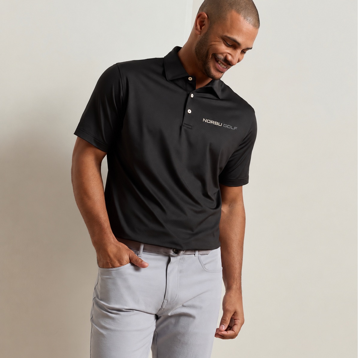 NORBU Performance Polo in black, worn front view