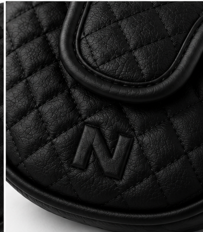 Close-up of the embossed N mark on the back of the NORBU Mallet Putter Cover