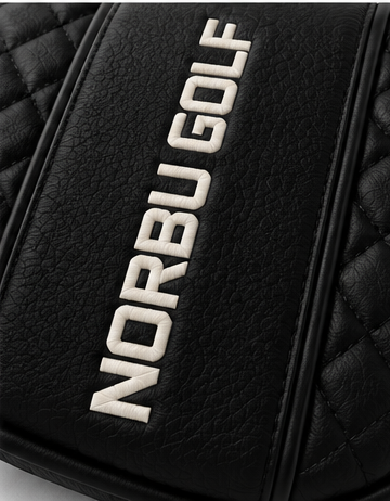 Close-up of the raised NORBU GOLF lettering and diamond quilting on the Mallet Putter Cover